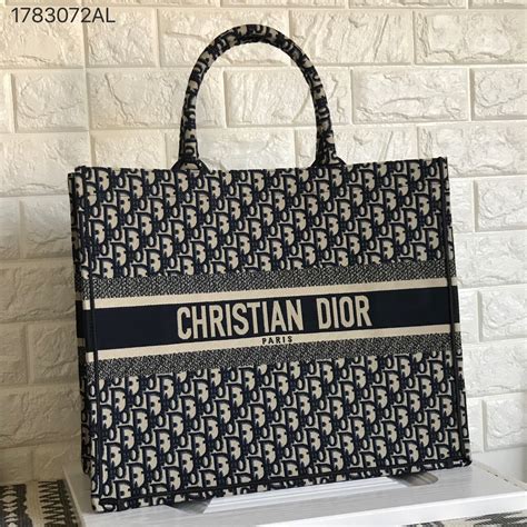 cartera christian dior precio original